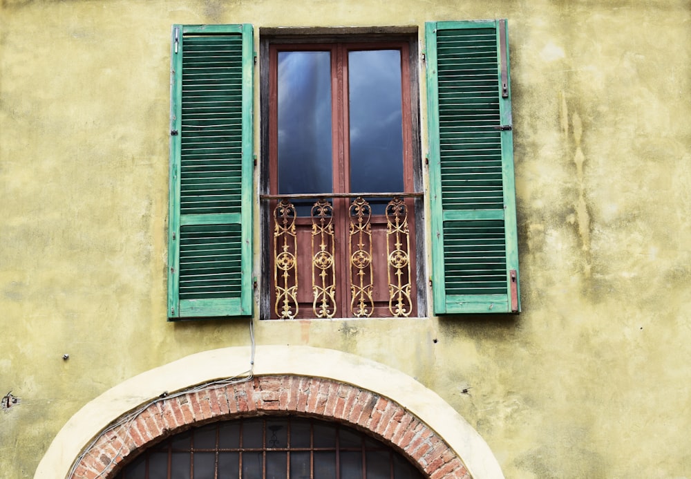 green and brown wooden window cover