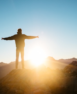 person standing on hill