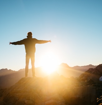 person standing on hill