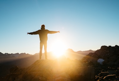 person standing on hill