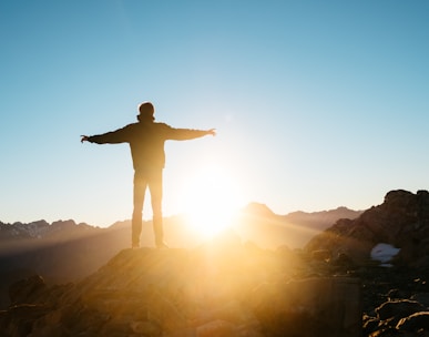 person standing on hill