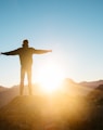 person standing on hill