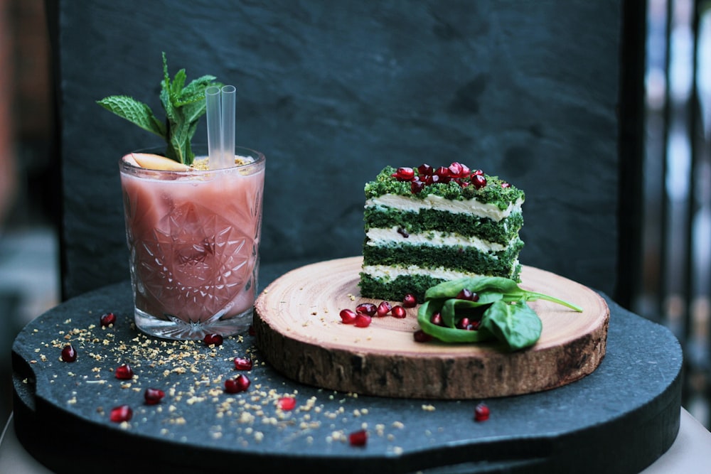 green and white cake slide on brown wooden plate