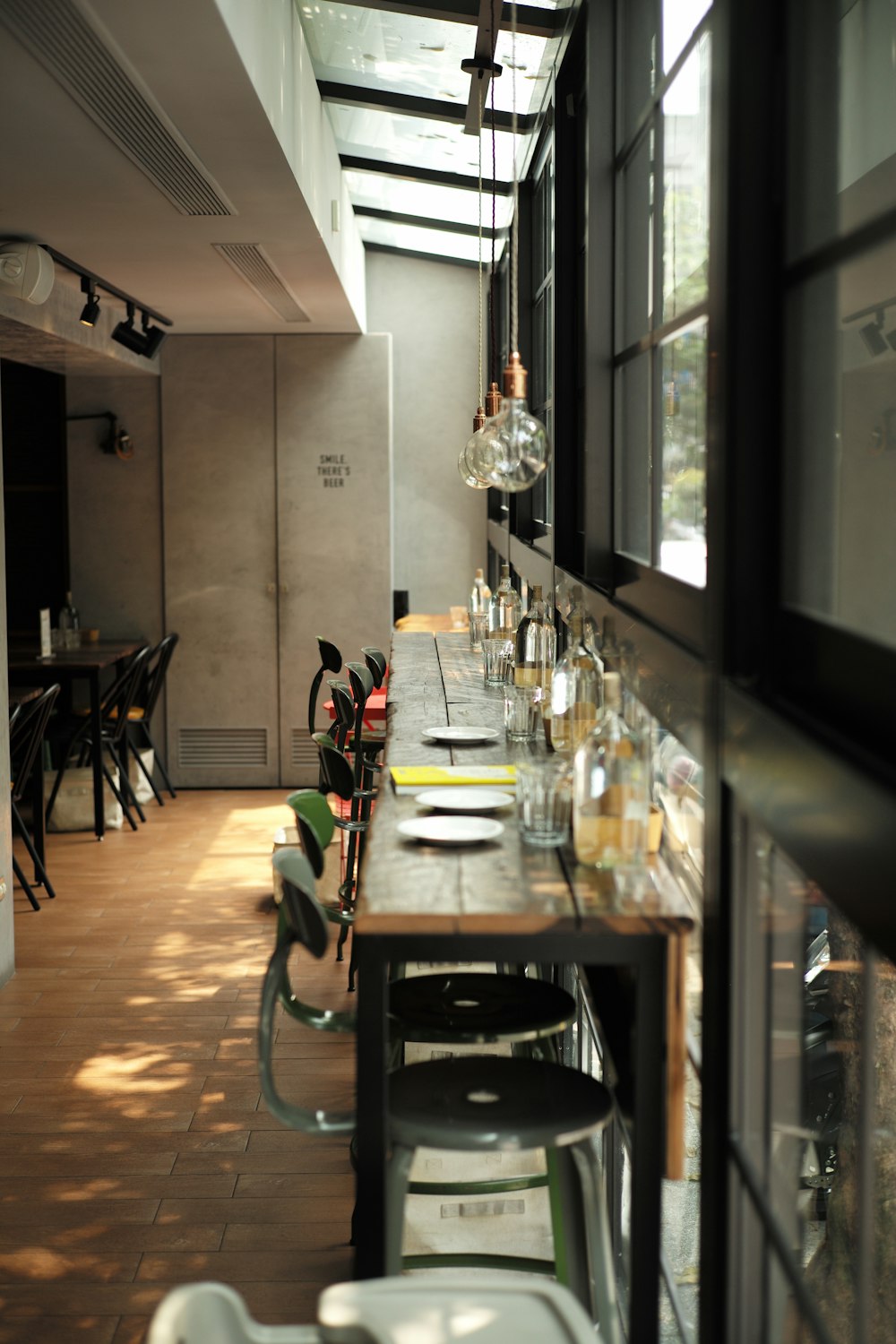 photograph of dining table arrangement with sphere pendant lamps