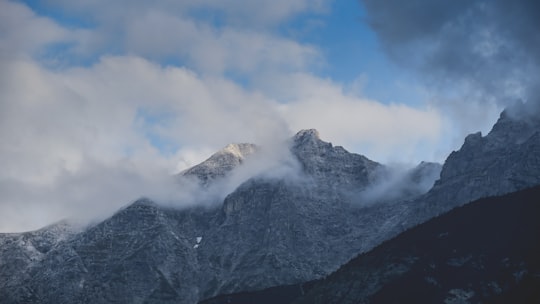 snow covered mountain under blue sky during daytime in Innsbruck Austria