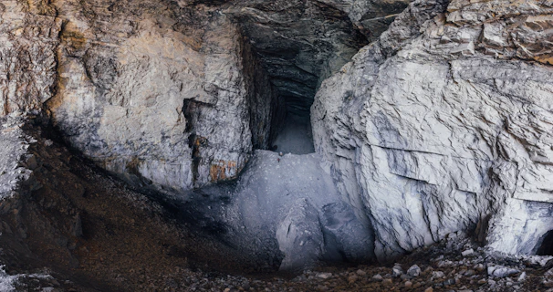 Detailed 3D scan of a complex underground mine showing dense point cloud data in bright green and blue hues.