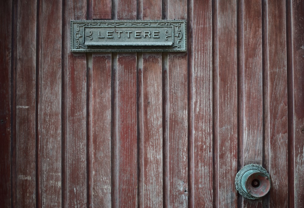 a red door with a sign on the side of it