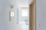Interior door with clean lines complementing a bright hallway.