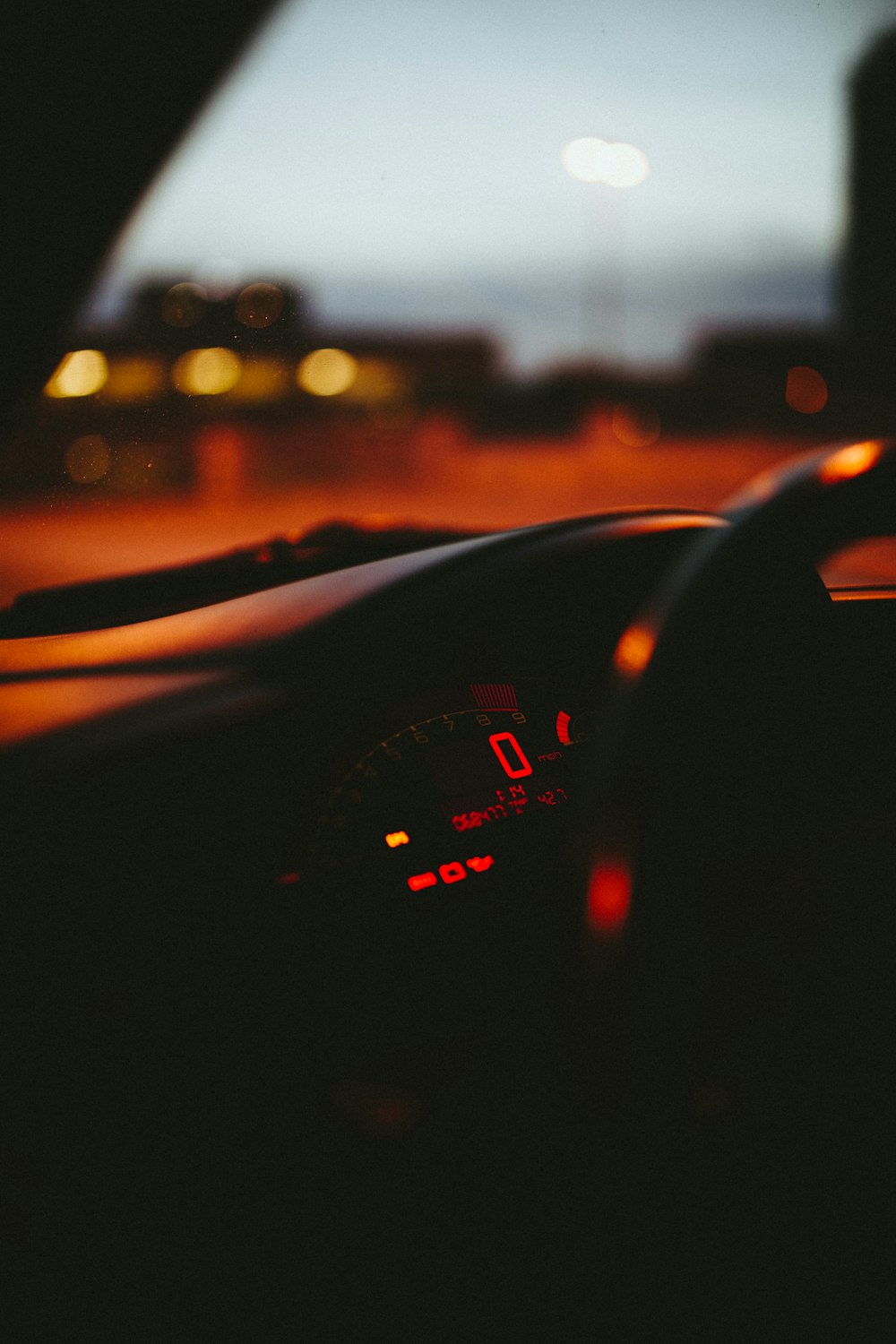 black car on road during sunset