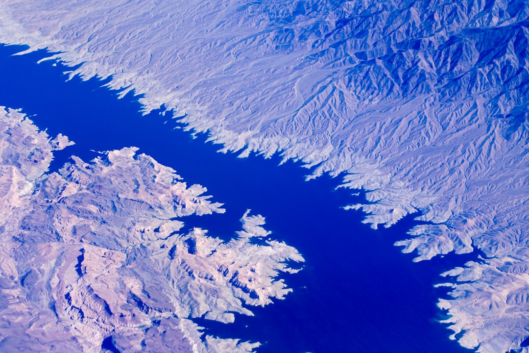 aerial photo of body of water in between mountains