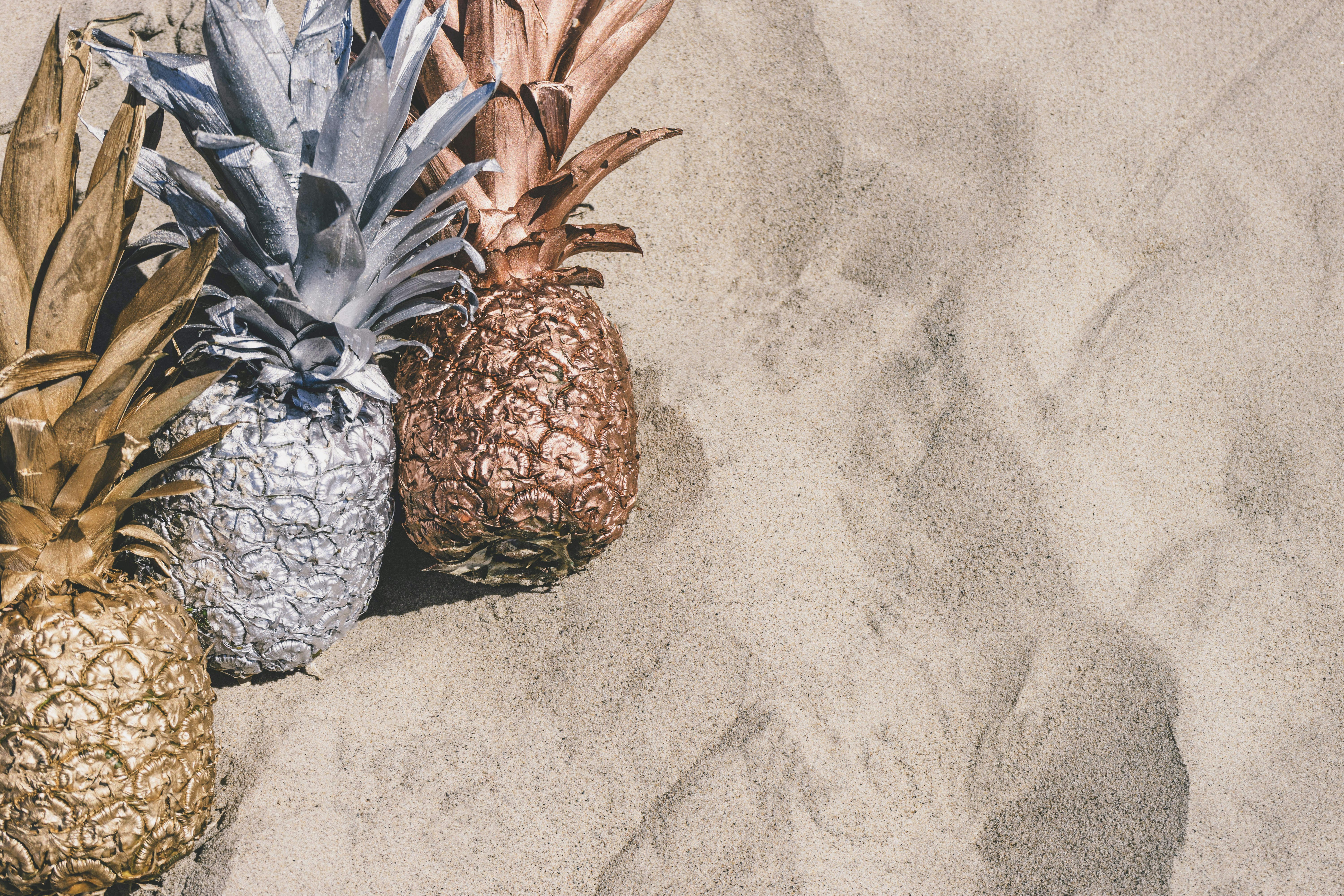 grey and brown pineapple fruit on grey surface