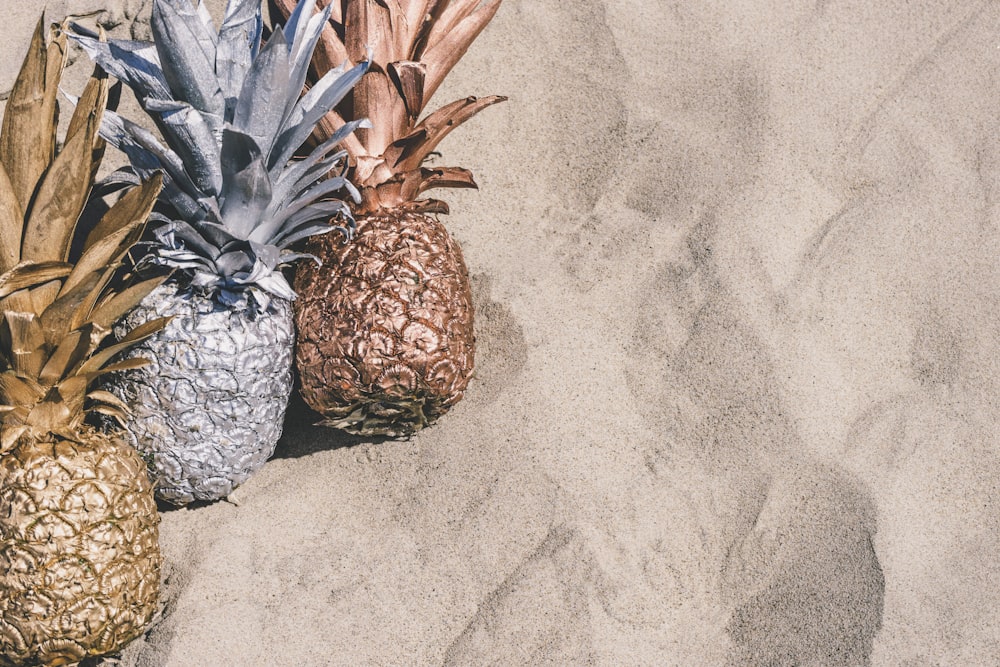 grey and brown pineapple fruit on grey surface