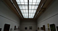 A panoramic view of the art house’s clean, modern interior with artwork displayed thoughtfully.