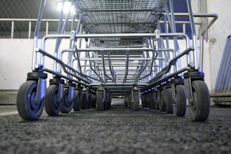 Close-up of sturdy metal supermarket gondola racks filled with goods