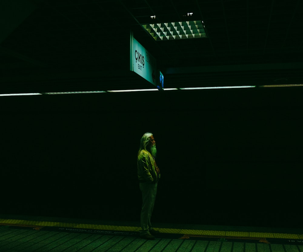woman standing under ceiling light