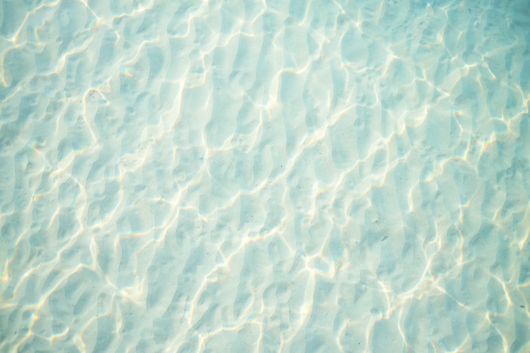 a view of the water from the bottom of a swimming pool - Water Damage Emergencies