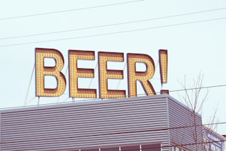 Exterior shot of Cygnus Brewing Co. building with industrial design elements and clear signage.