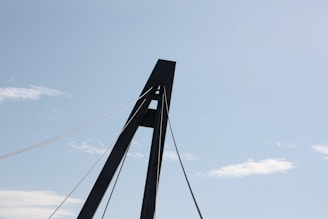 Close-up of a modern bridge structure showcasing steel beams and cables.