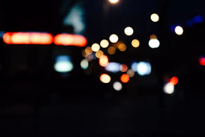 Abstract urban nightscape with blurred lights mimicking a slow shutter effect.