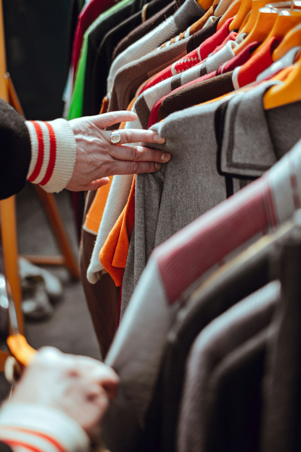 person holding hang clothes