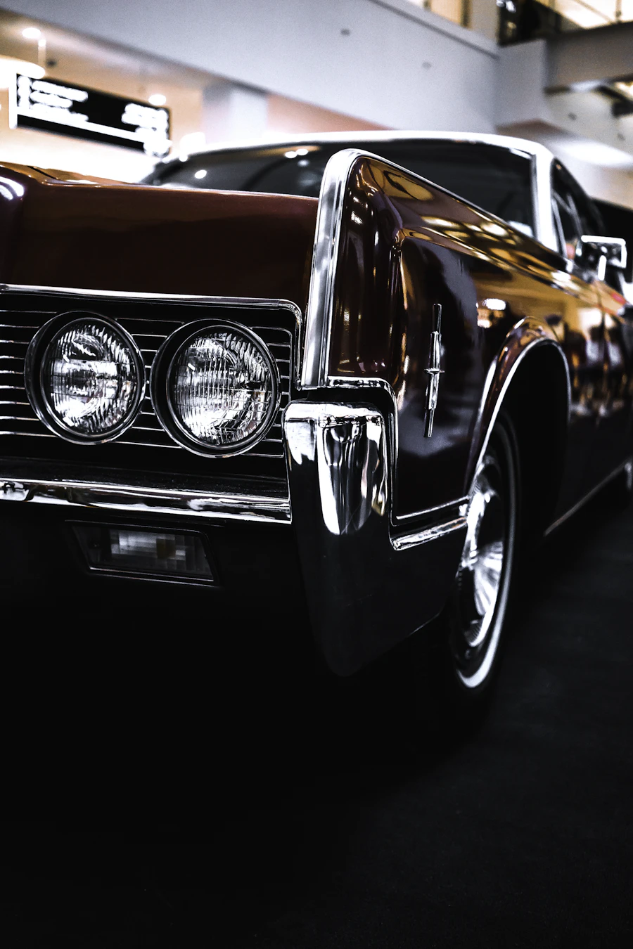 Chrome trim and deep black paintwork on a classic car