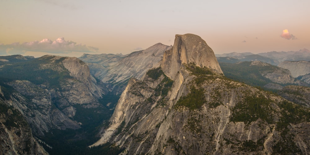 aerial photography of gray and green grass field mountain