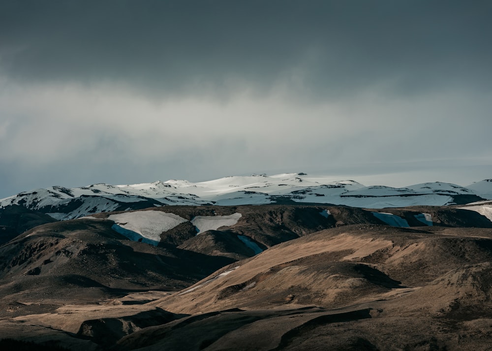 snow capped mountain under dim sky