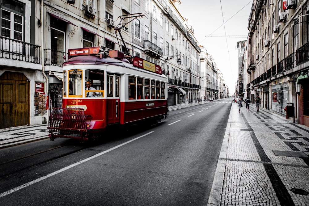 white and red vehicle on road