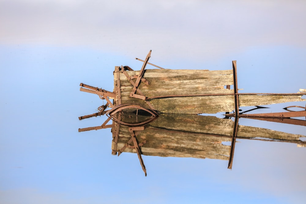 brown wooden ship wheel under blue sky during daytime