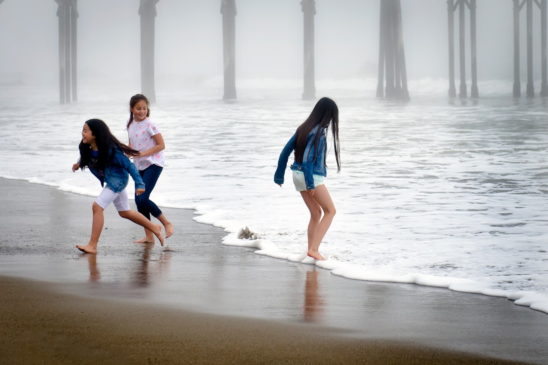 girls playing on shore