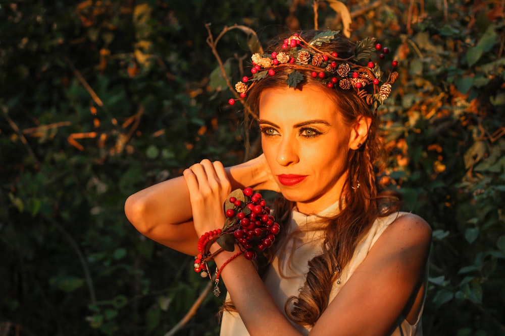 selective focus photography of woman with berry crown on her head