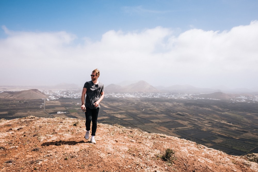 man standing on plateau