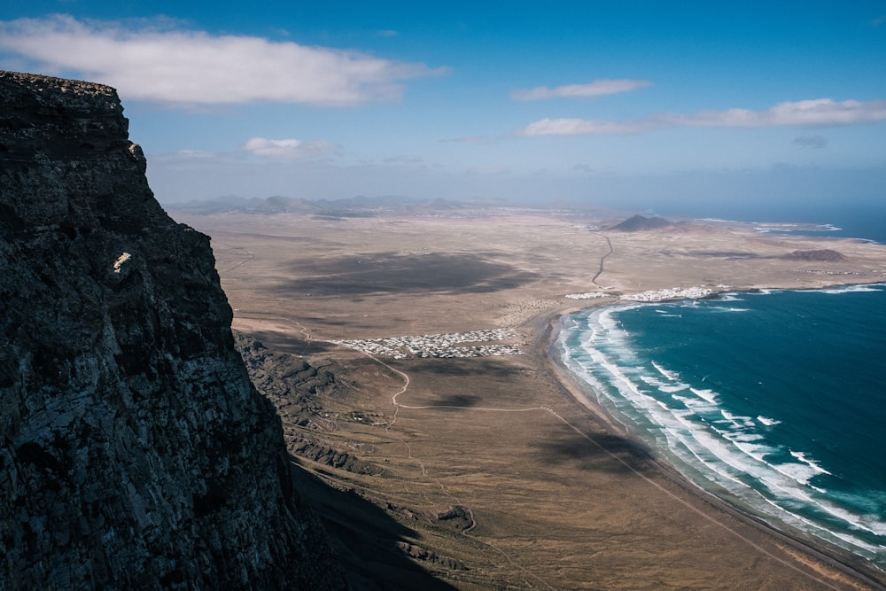aerial photo of ocean in front mountain