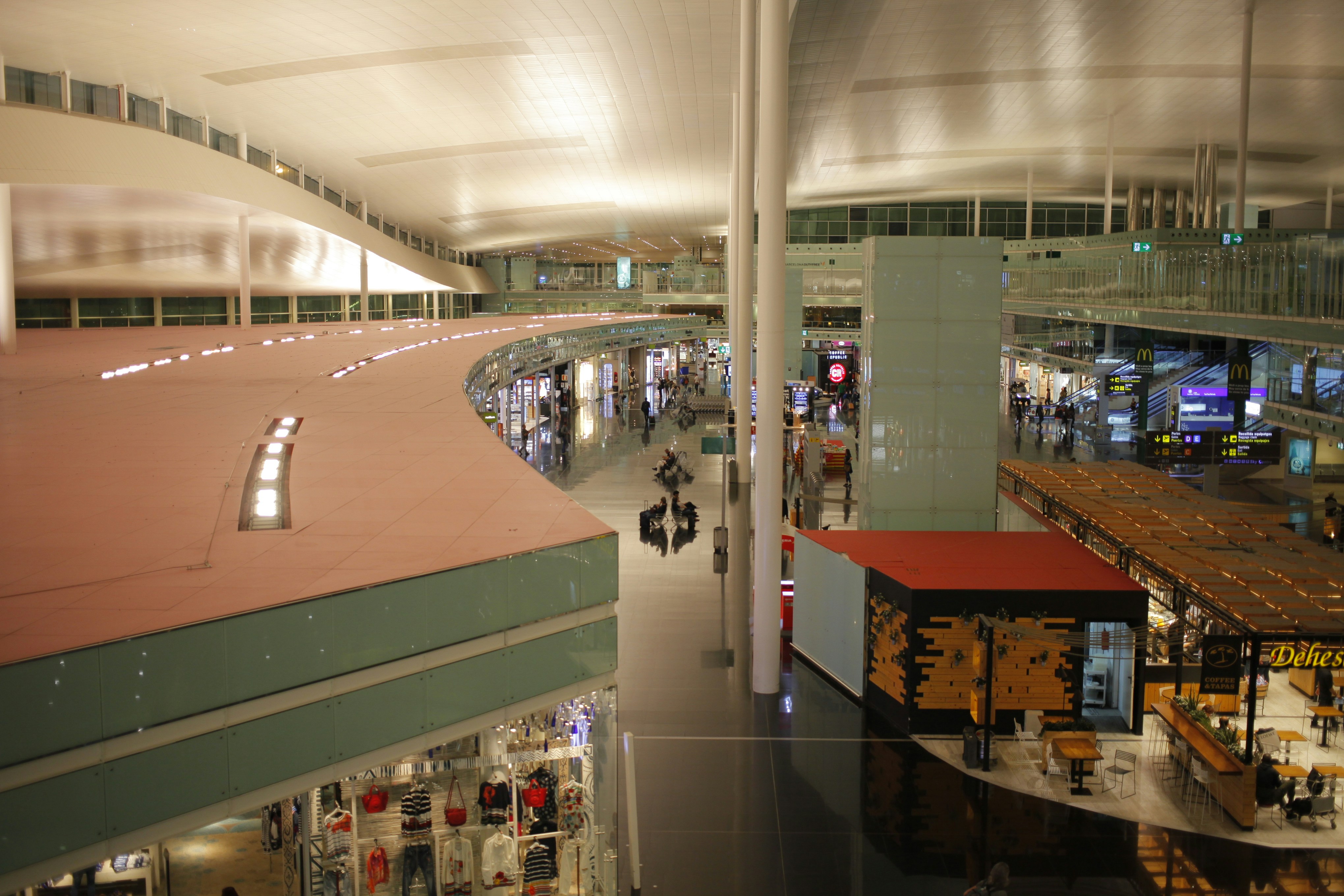 Modern airport terminal interior, bright open space, international travel hub, clean architecture