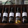several labeled bottles on rack