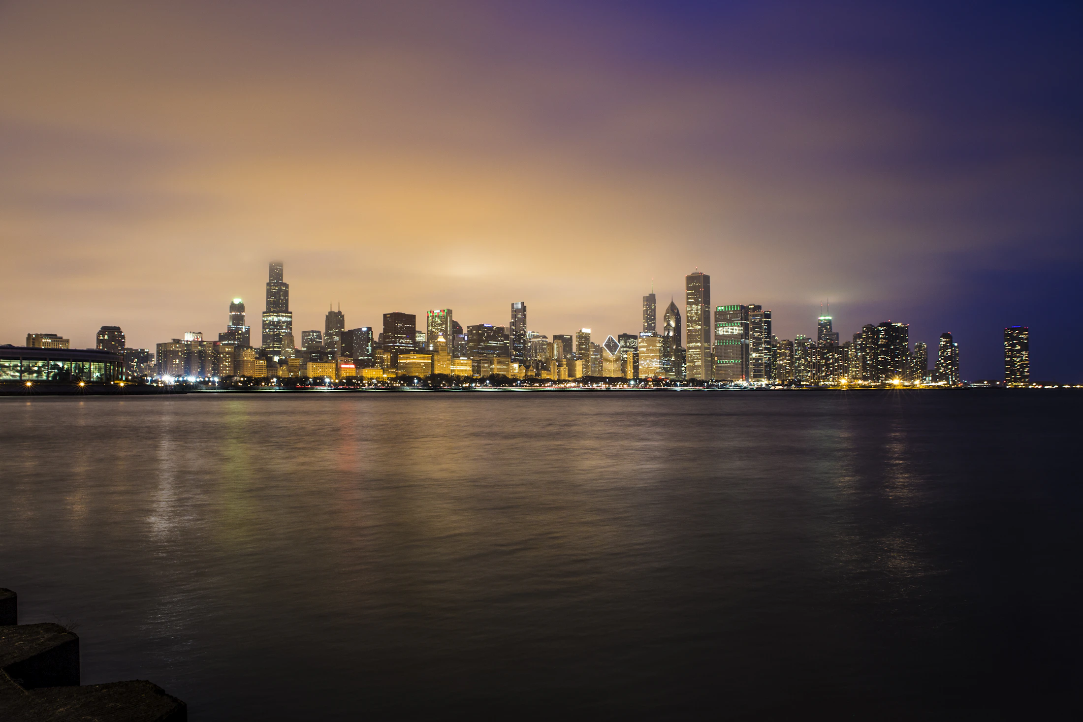The Chicago skyline along the lakefront at golden hour.