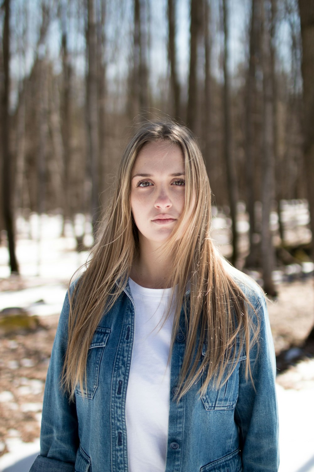 photo of a women wearing washed denim jacket