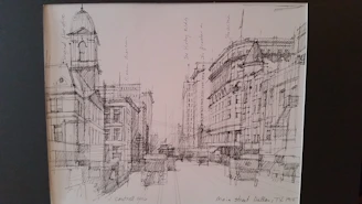 A detailed pencil sketch of a modern architectural facade with hand-drawn annotations and subtle shading.