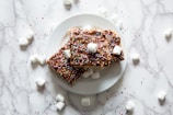Homemade brigadeiros decorated with chocolate sprinkles on a festive plate