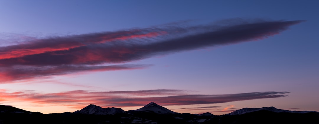 mountain ranges under clouds