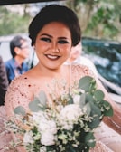 An actress smiling warmly while mingling with attendees at a formal gala.