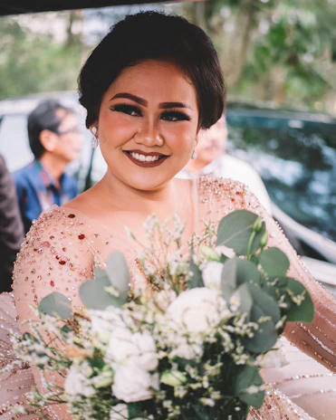 Cristina coordinating event details with a friendly smile, embodying professionalism and warmth.