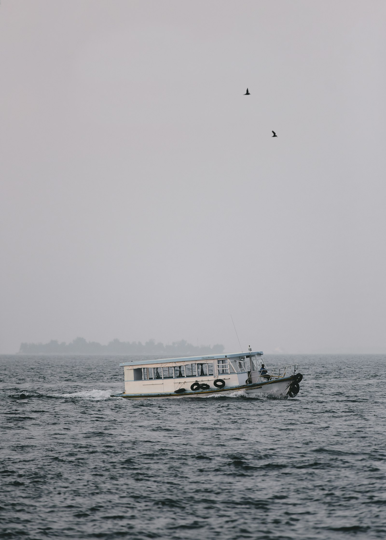 Nikon D810 sample photo. Passenger boat during cloudy photography