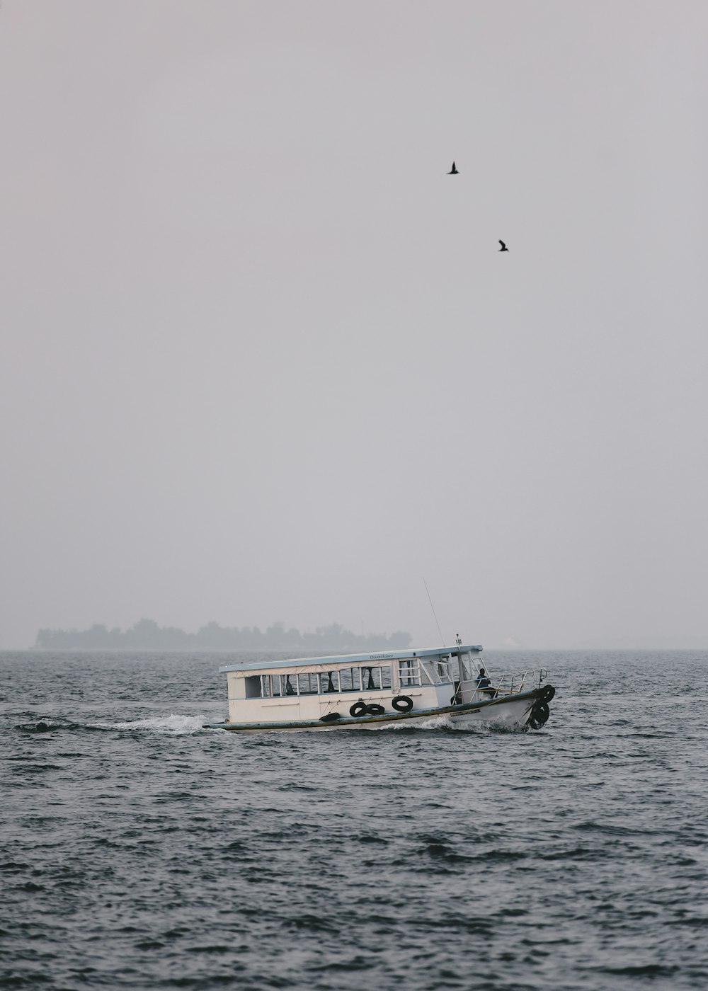 passenger boat during cloudy day