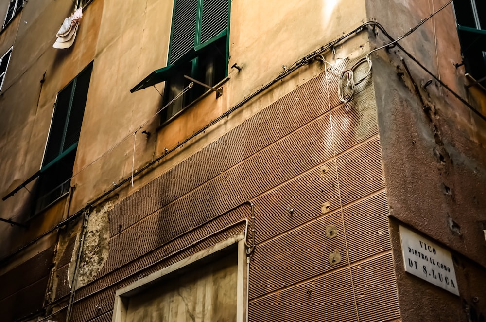 low angle photography of brown concrete building