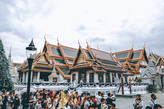 group of people neat temple in Democracy Monument Thailand