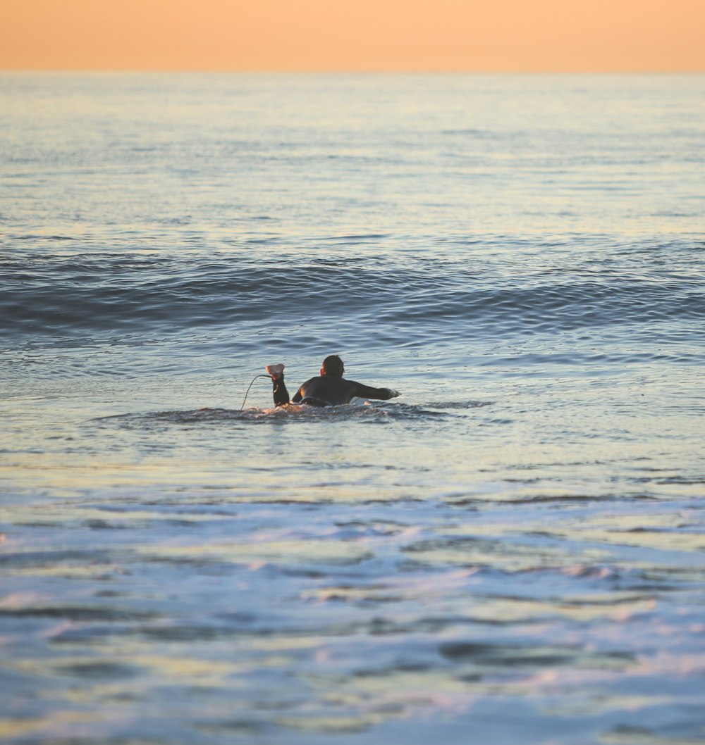 man in water during daytime