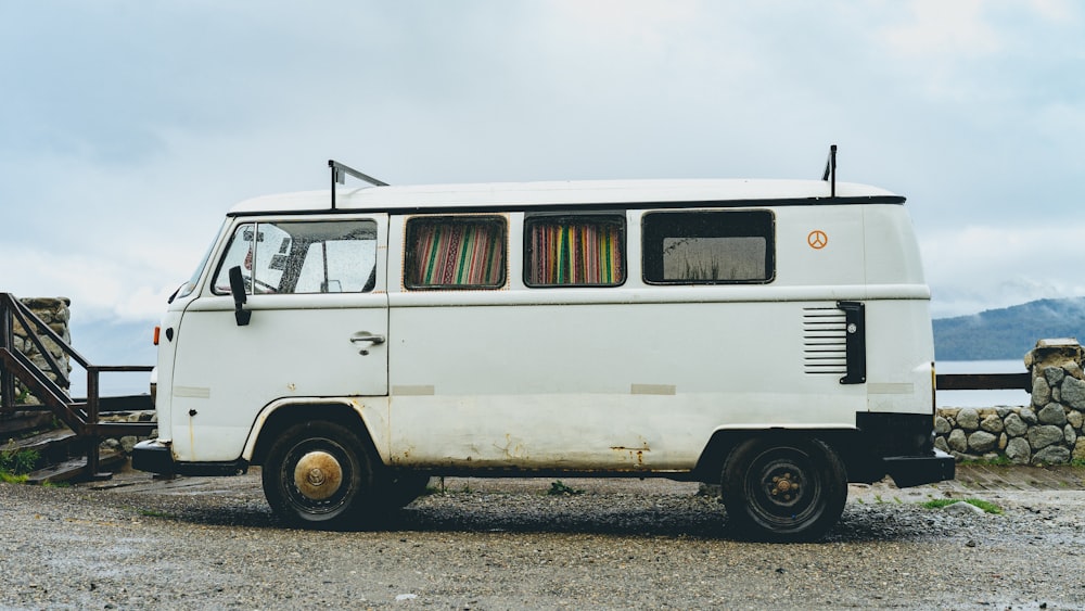 parked empty white van under cloudy sky