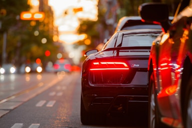 street photography,how to photograph road warrior; black audi r8 parked beside road