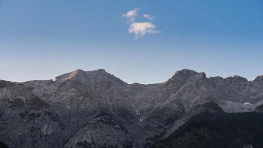 rocky mountain under blue sky during daytime in Innsbruck Airport Austria